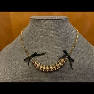 Betsey Johnson gold-tone necklace with glittery beads, rhinestones, and bows